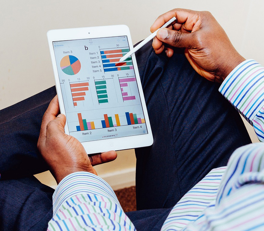 Man viewing Big Data analytics on mobile tablet device